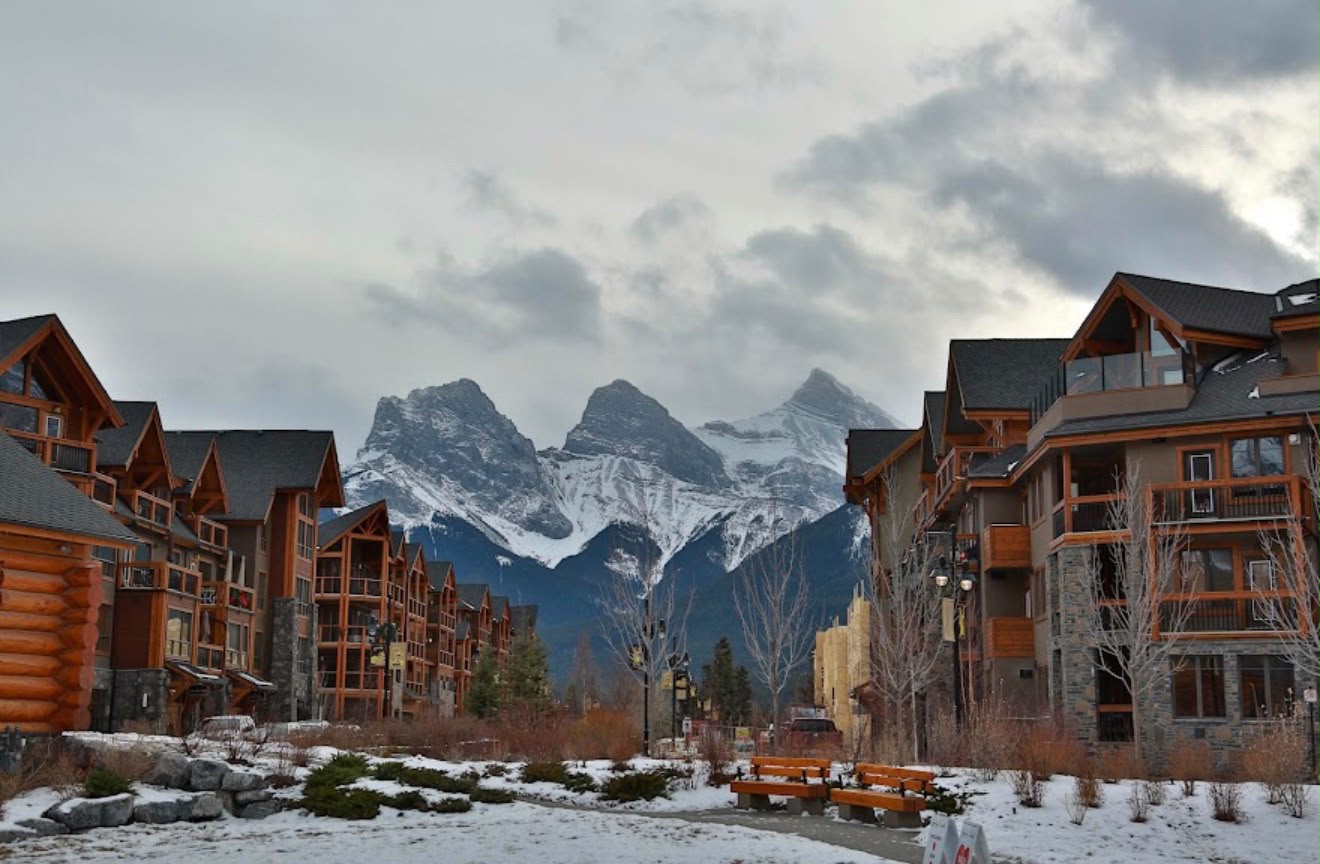 Canmore homes framed by snow-covered mountains
